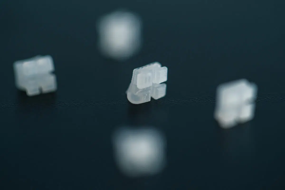 A group of white plastic pieces sitting on top of a table.